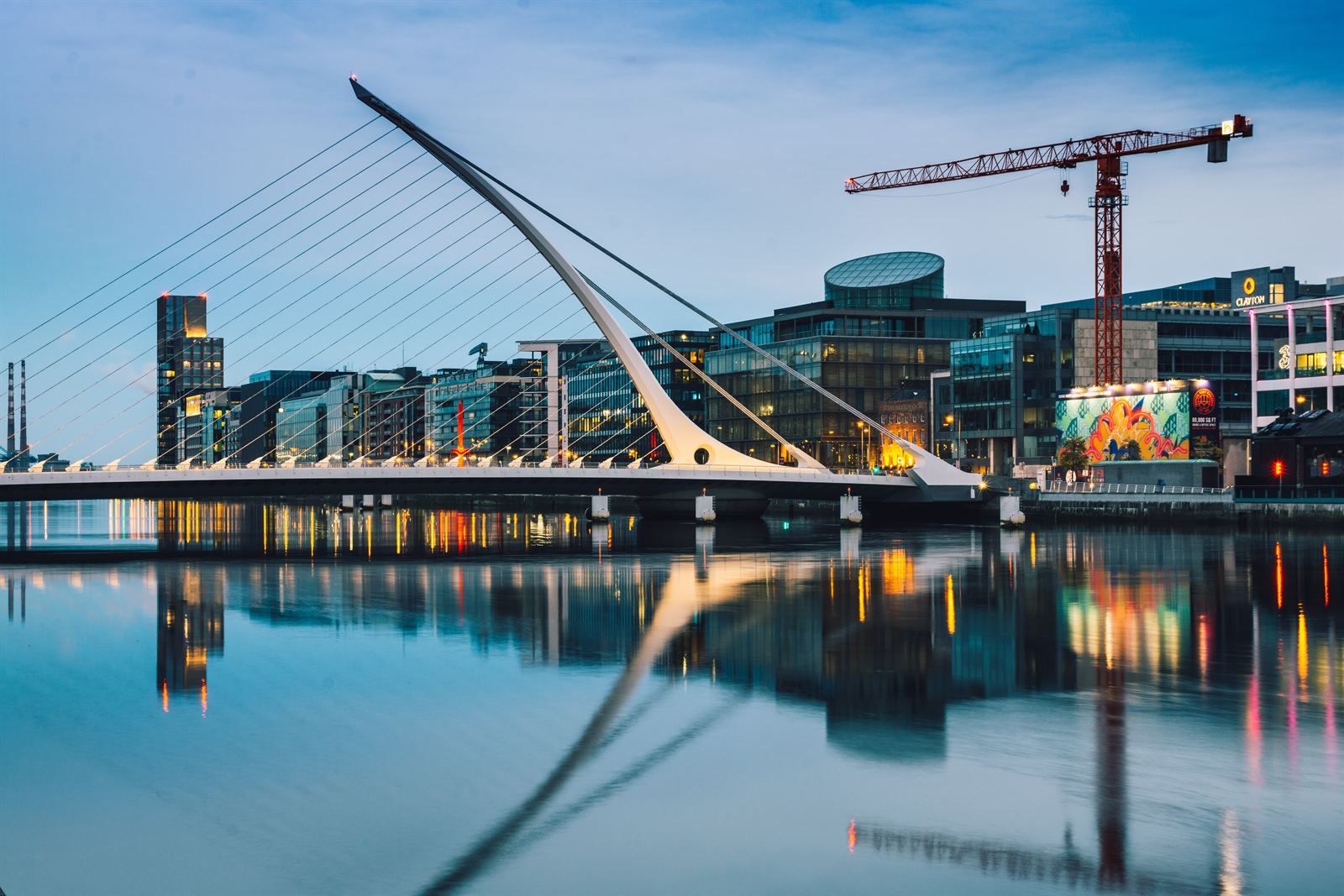 The harp-shaped Samuel Beckett Bridge over the River Liffey in Dublin at dusk