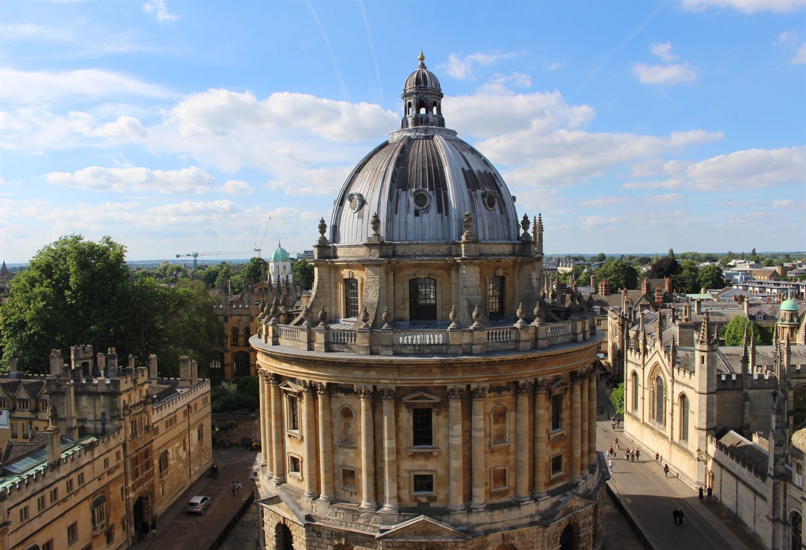 The domed Radcliffe Camera library surrounded by Oxford college buildings and spires